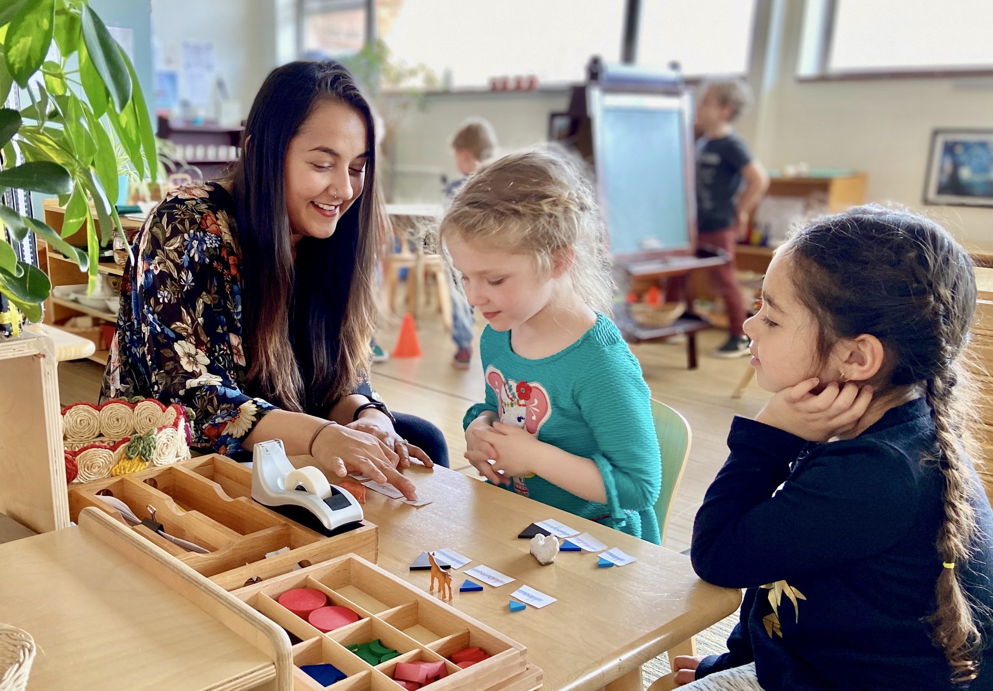 Child exploring Montessori materials in a prepared environment